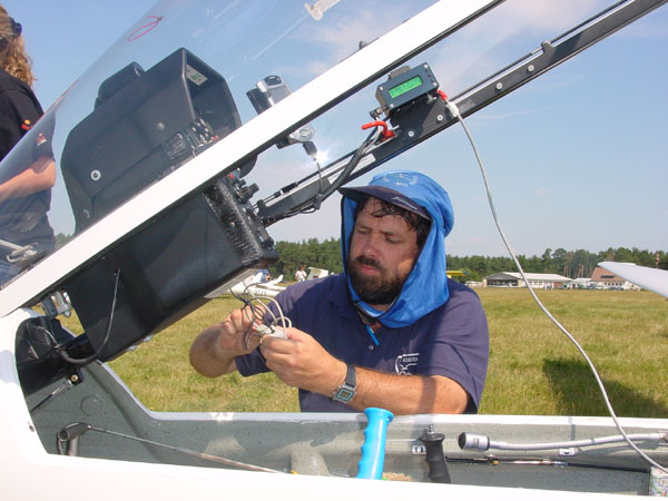 Steve workign on the Volkslogger wiring in Lisa Turner's glider